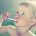 toddler boy brushing his teeth 2