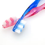 pink and blue toothbrushes 2