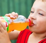 child drinking orange soda 4