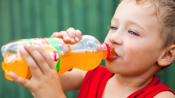 child drinking orange soda 3