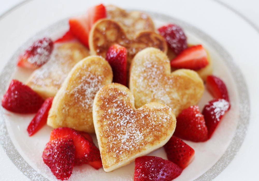 heart shaped pancakes with strawberries